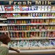 A girl in school uniform walks past Brookside dairy milk products displayed on a shelf inside the Nakumatt Lifestyle supermarket in Kenya's capital Nairobi, July 18, 2014. French food group Danone said it was buying a 40 percent stake in Brookside, East Africa's top dairy producer, as part of plans to expand in new markets while growth is weak in Europe and the economy slows in China. The deal, whose financial terms were not disclosed, was sealed with the controlling Kenyatta family, relatives of Kenya President Uhuru Kenyatta, and will boost Danone's earnings, Emmanuel Marchant, vice-president for corporate development, told Reuters by phone on Friday.